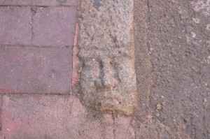Cool carved kerb stones faces in Nuoro, Sardinia