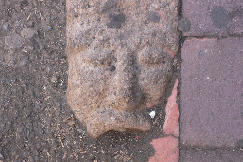  Carved faces kerb stones in Nuoro, Sardinia 