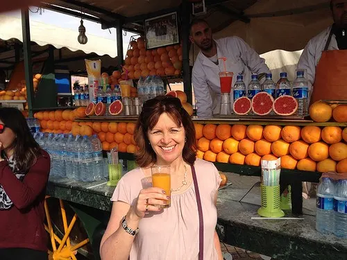 Heather tries a freshly squeezed orange juice in Jemaa El Fnaa, Marrakech Photo: Heatheronhertravels.com