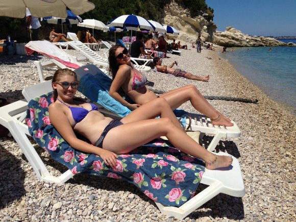 Beach beauties hang out naked below the sun