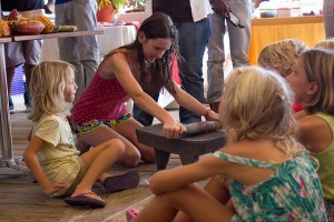 Children learn about making chocolate at the Grenada Chocolate Festival