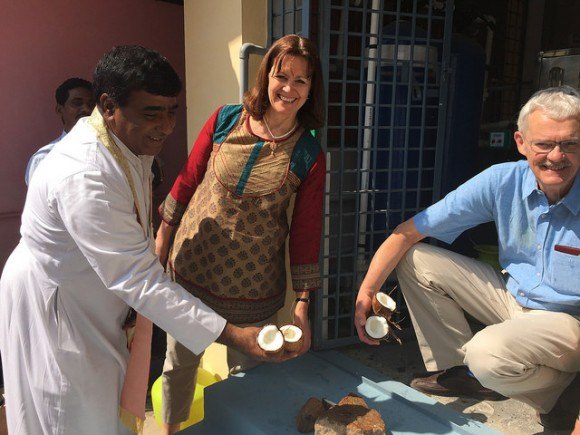 Breaking coconuts to open the water purification unit in Ananthapur, India Photo: Heatheronhertravels.com