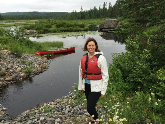 Wearing a waterproof jacket on my Canada canoe trip