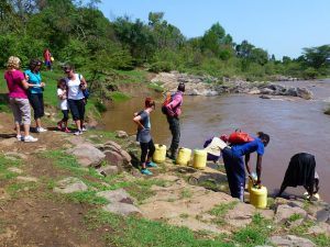 Collecting water from the river in Kenya Photo: Audley Travel
