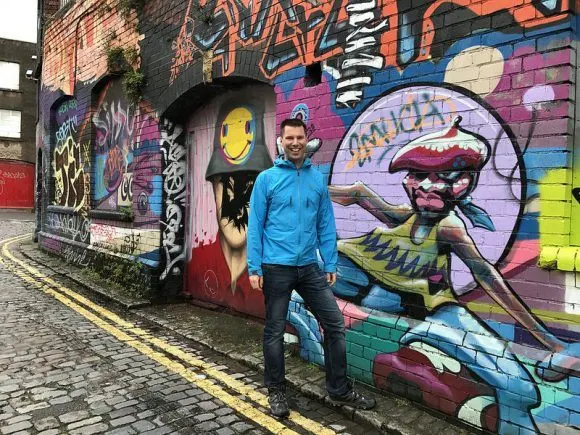 Erik with Street art on Stokes Croft