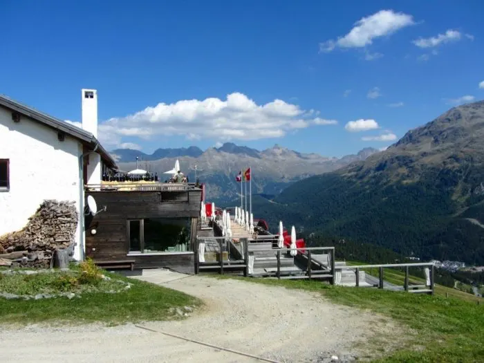 Flowers and greenery in between the mountains El Paradiso restaurant near St Moritz Engadin Photo © 2018 • The Artful Passport