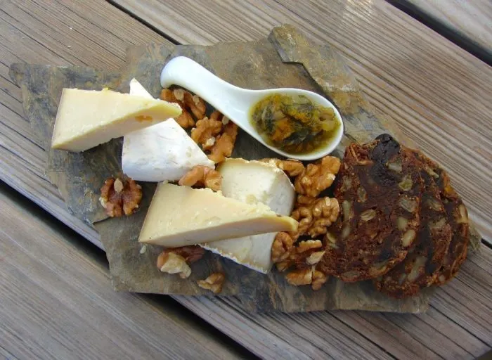 El Paradiso’s tasty cheese plate with date nut bread, walnuts and honey - hiking in St Moritz Switzerland Photo © 2018 • The Artful Passport