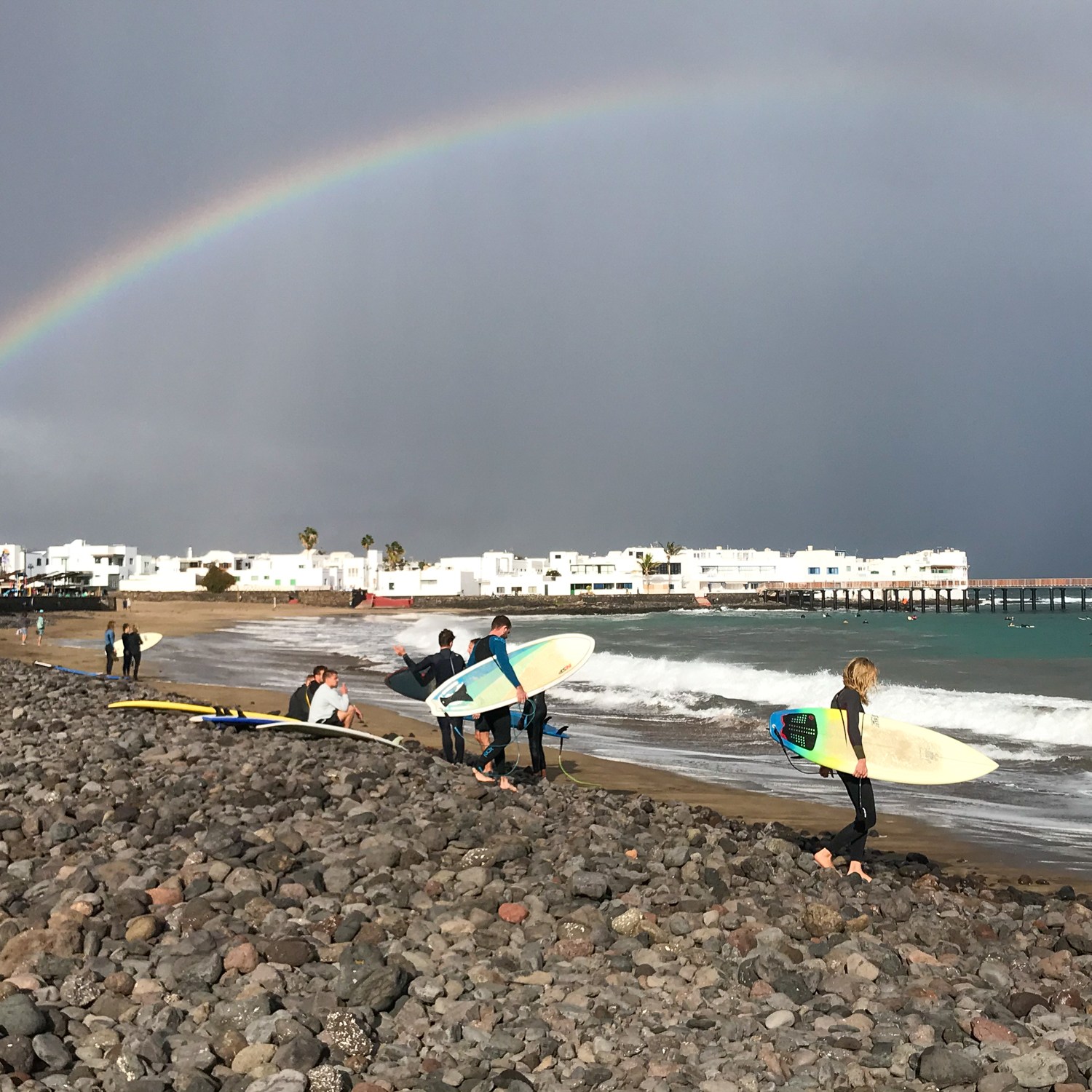 Surfers of Playa de la Garita at Arrieta in Lanzarote