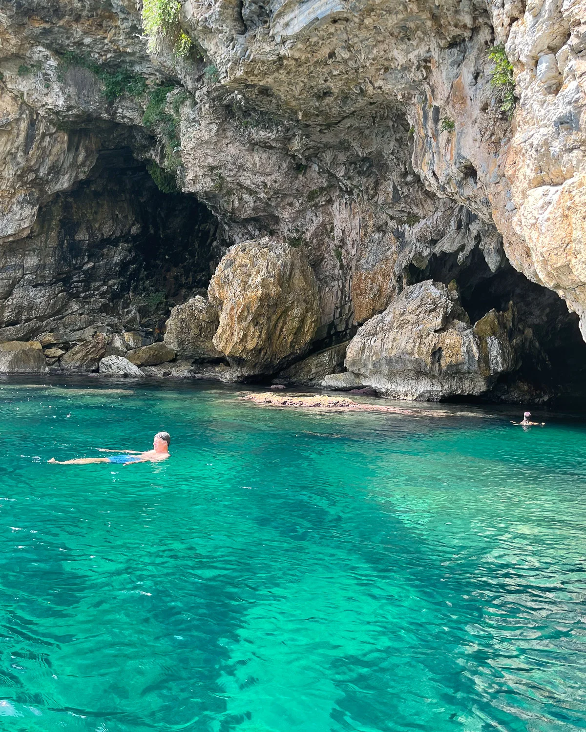 Swimming in sea caves boat trip from Agios Ioannis Pelion Greece Photo Heatheronhertravels.com